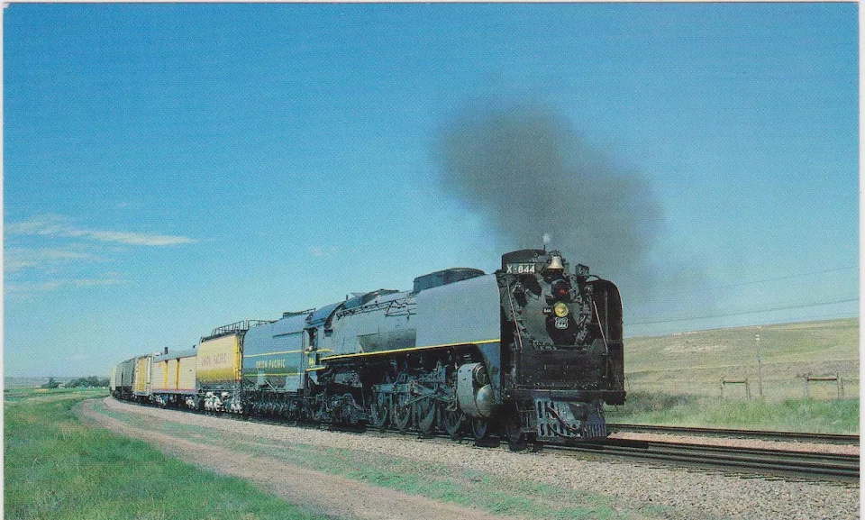 Union Pacific 844 operating a revenue freight ferry move for Topeka Railroad Days in August of 1989.