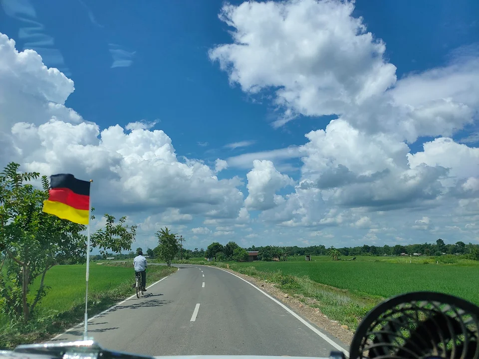 Taxi with a German flag somewhere in rural India (flag put up to show support for World Cup)