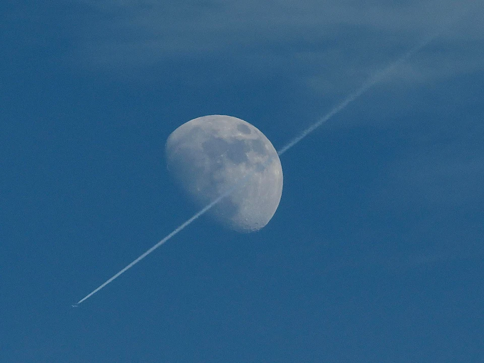 Lucky shot this afternoon of a jet transitioning the moon near New Orleans