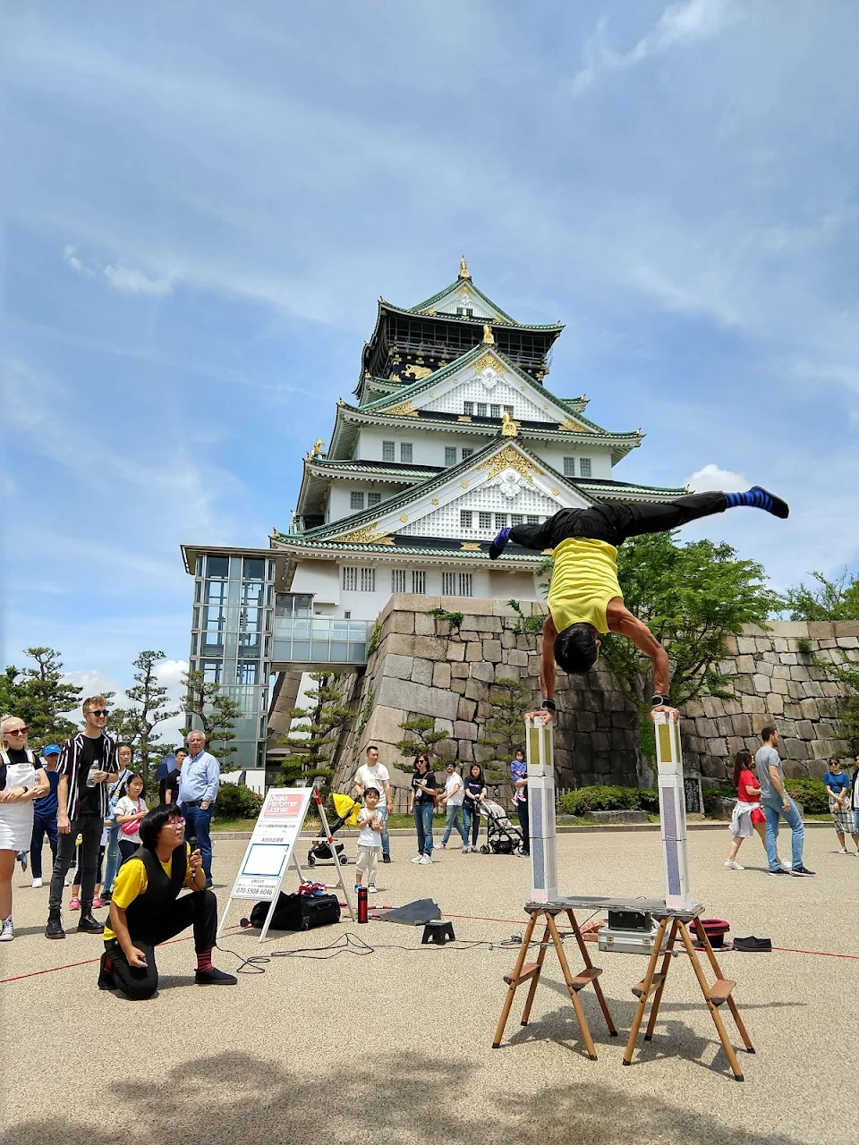 street performers in front of the osaka castle