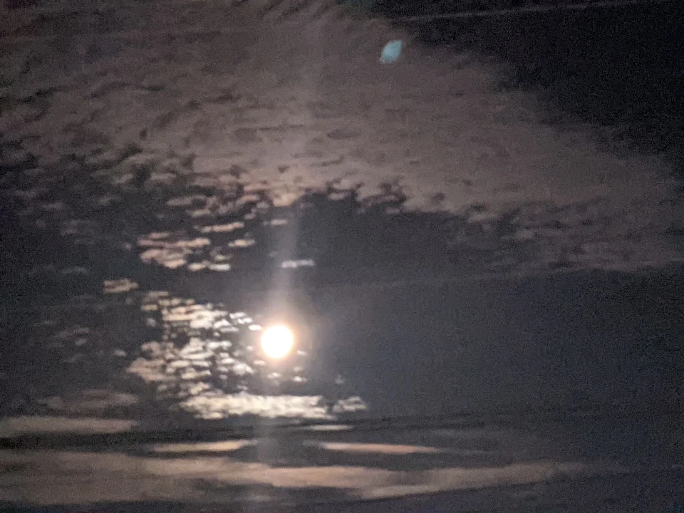 The Moon Surrounded by Clouds