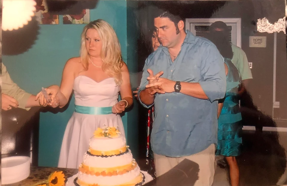 My favorite picture from our wedding. My mother is handing me the knife.