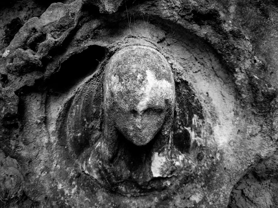 A weather beaten angel on a headstone