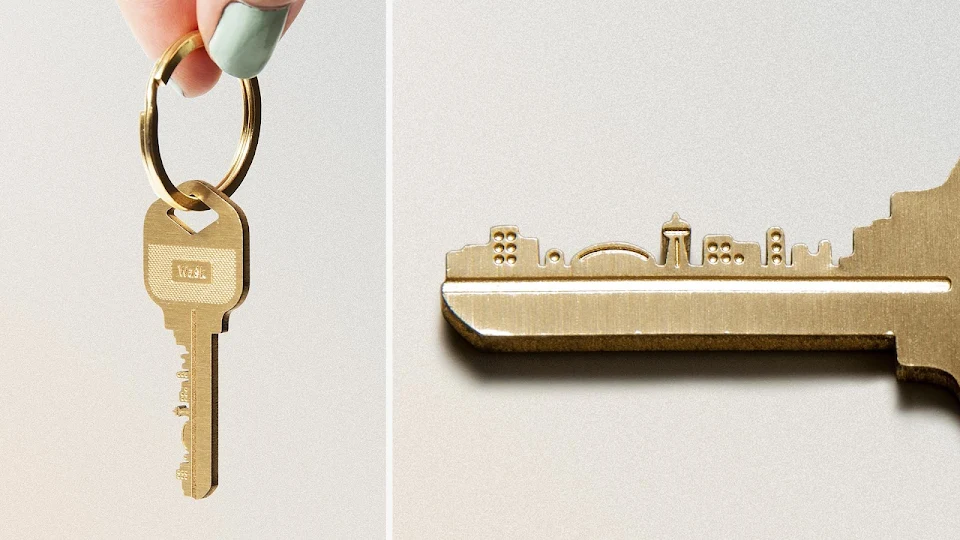 A key with a city on the blade.