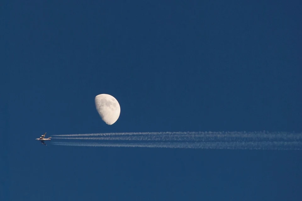 I somehow managed to get a shot of the moon and a plane going by.
