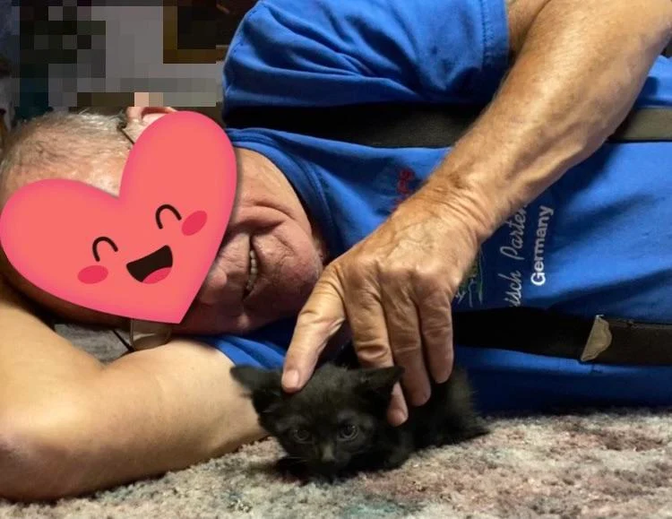 I got my grandpa a kitten tonight. He laid like this with her on the floor forever when we brought her in.