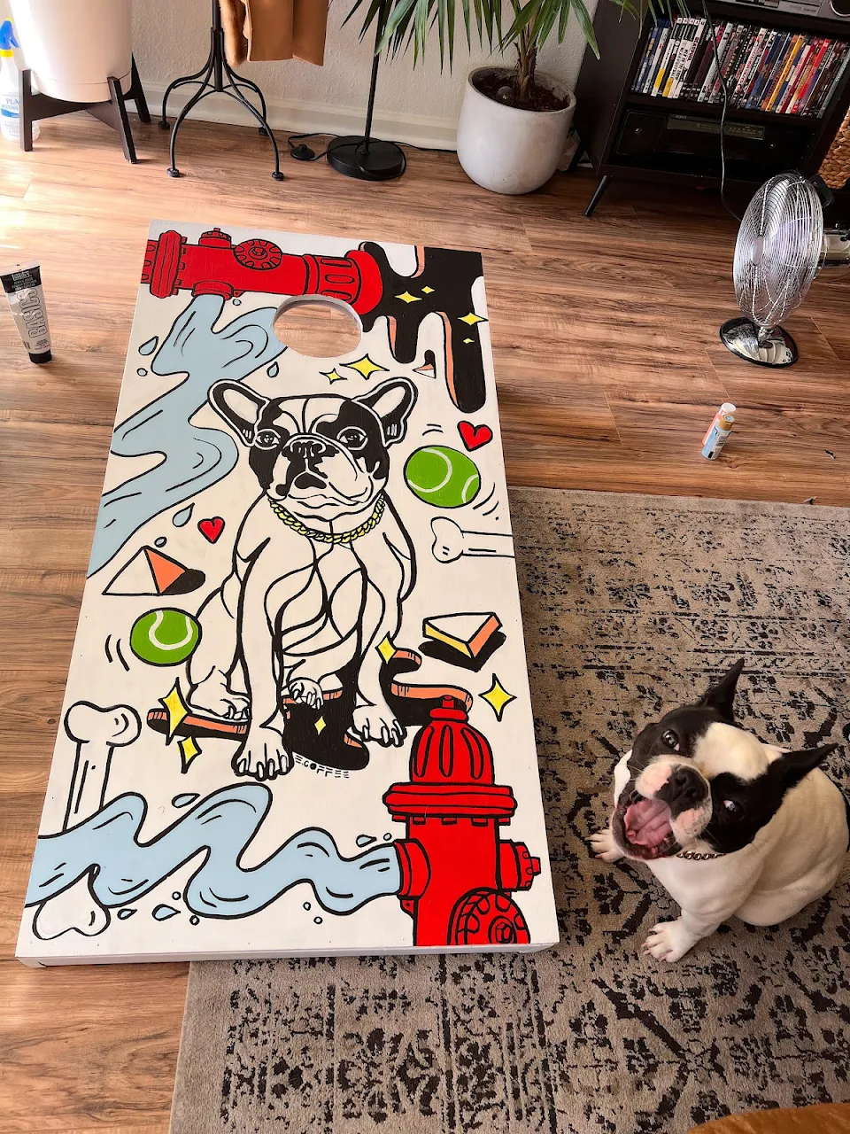 I painted my dog on one of our corn hole boards this weekend. This is the big reveal: