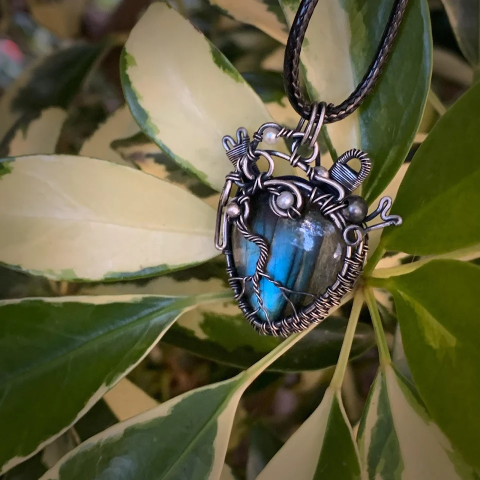 A heart necklace I handmade with sterling silver wire and a labradorite.