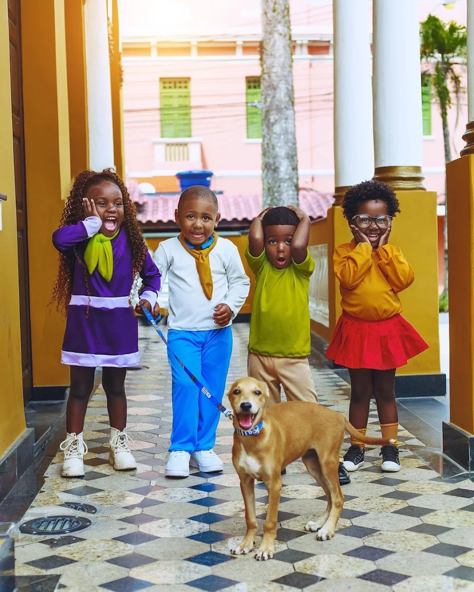 Kids and a puppy dressing up as Scooby Doo.
